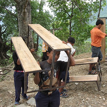Volunteering carrying new desks to Bhairabi (2)